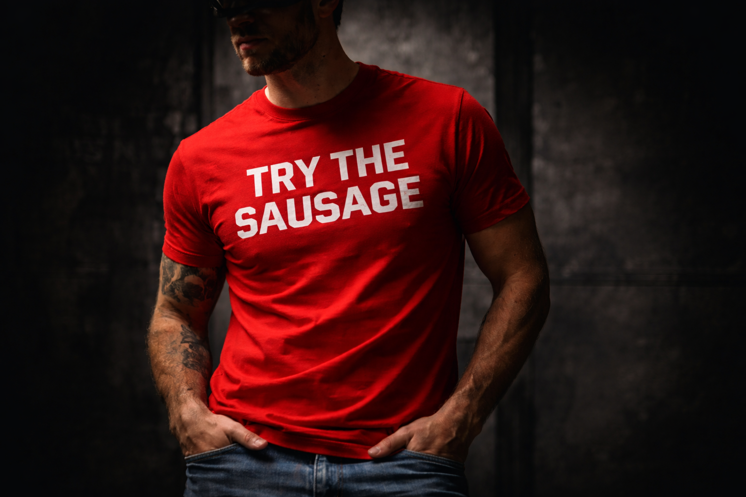 Person wearing a red t-shirt with 'TRY THE SAUSAGE' text on a dark background